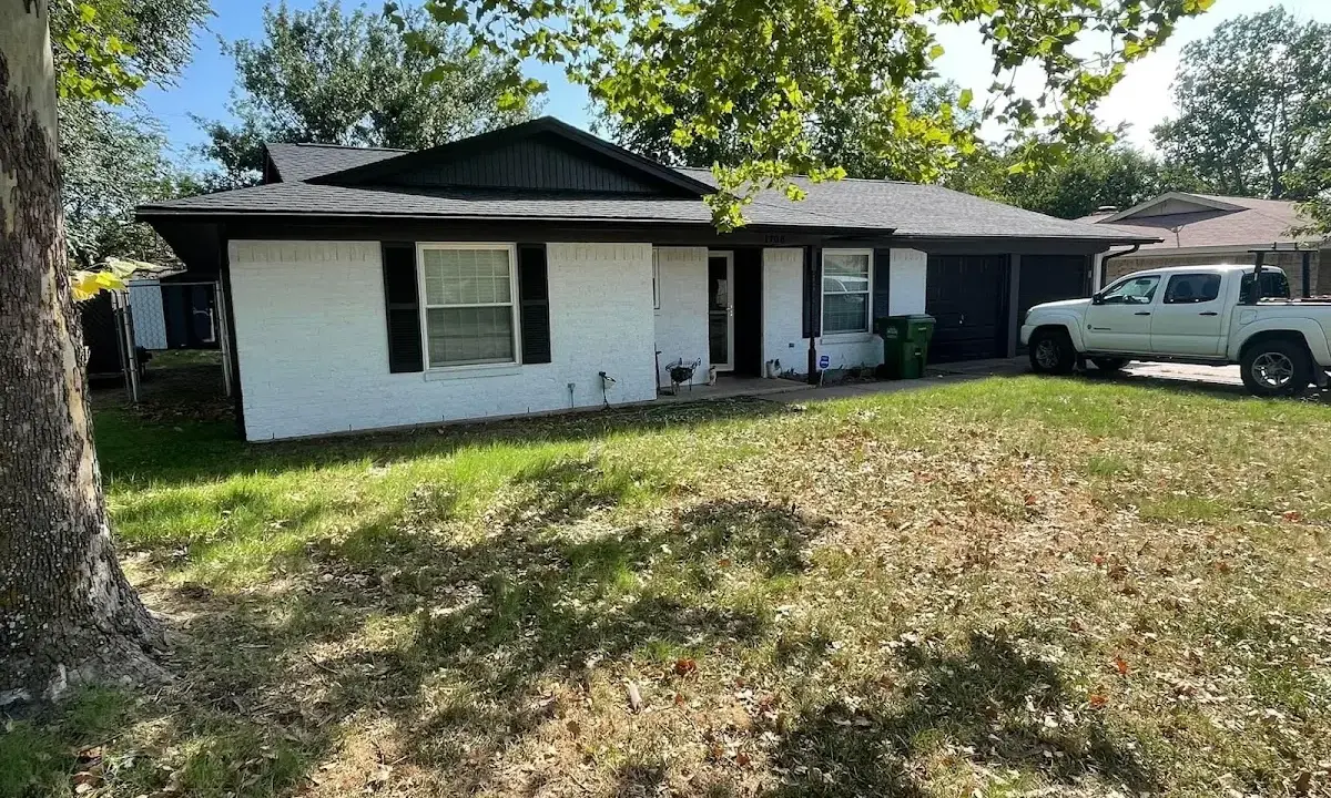 Professional roofing crew working on a residential roof in Maple Heights
